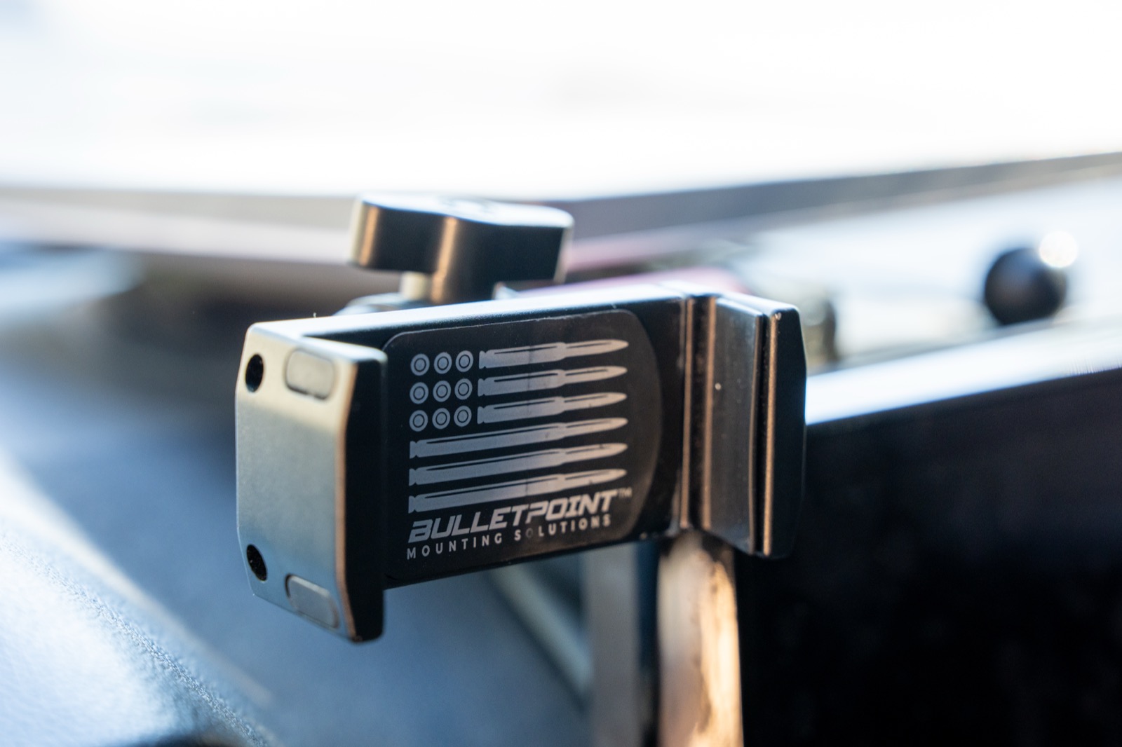 Bulletpoint spring-loaded phone holder mounted in front of the Tacoma screen