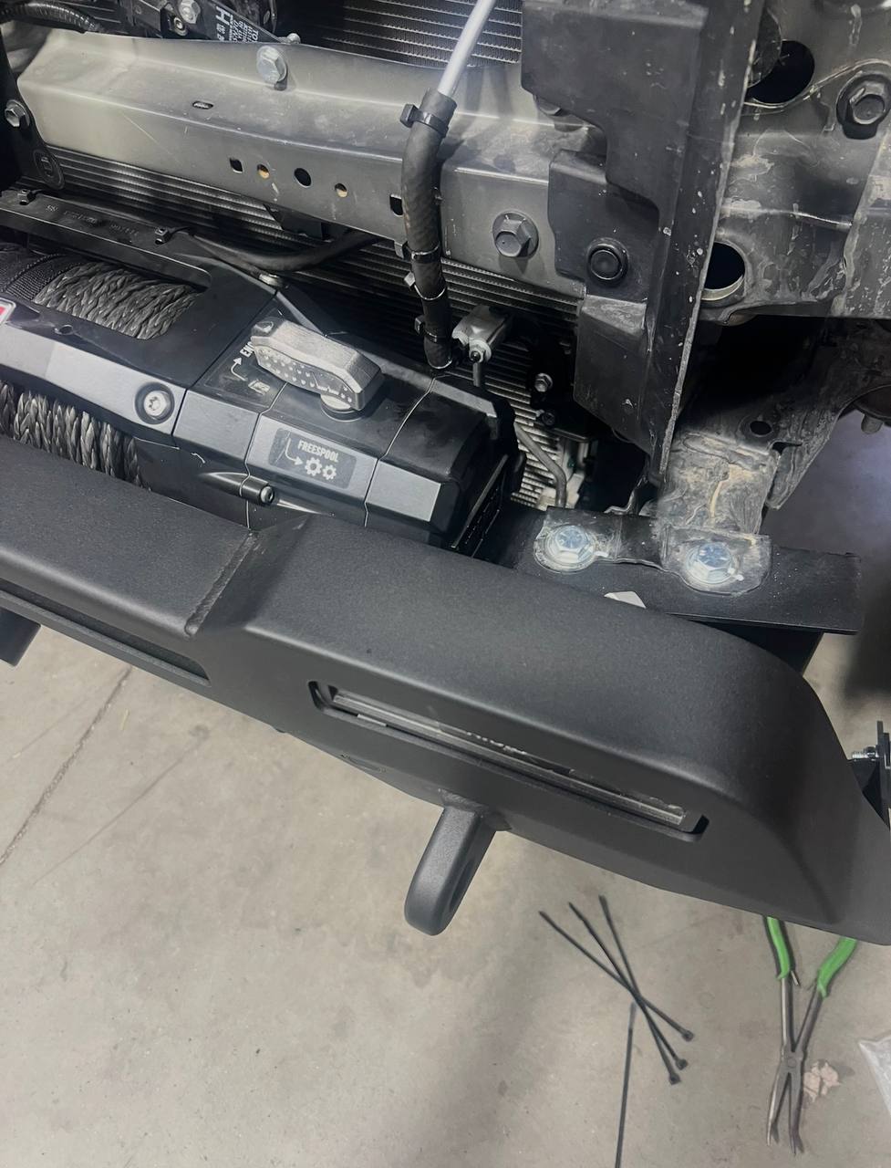 Winch area showing the tight clearance where the AC line ruptured against the Zeon 10S