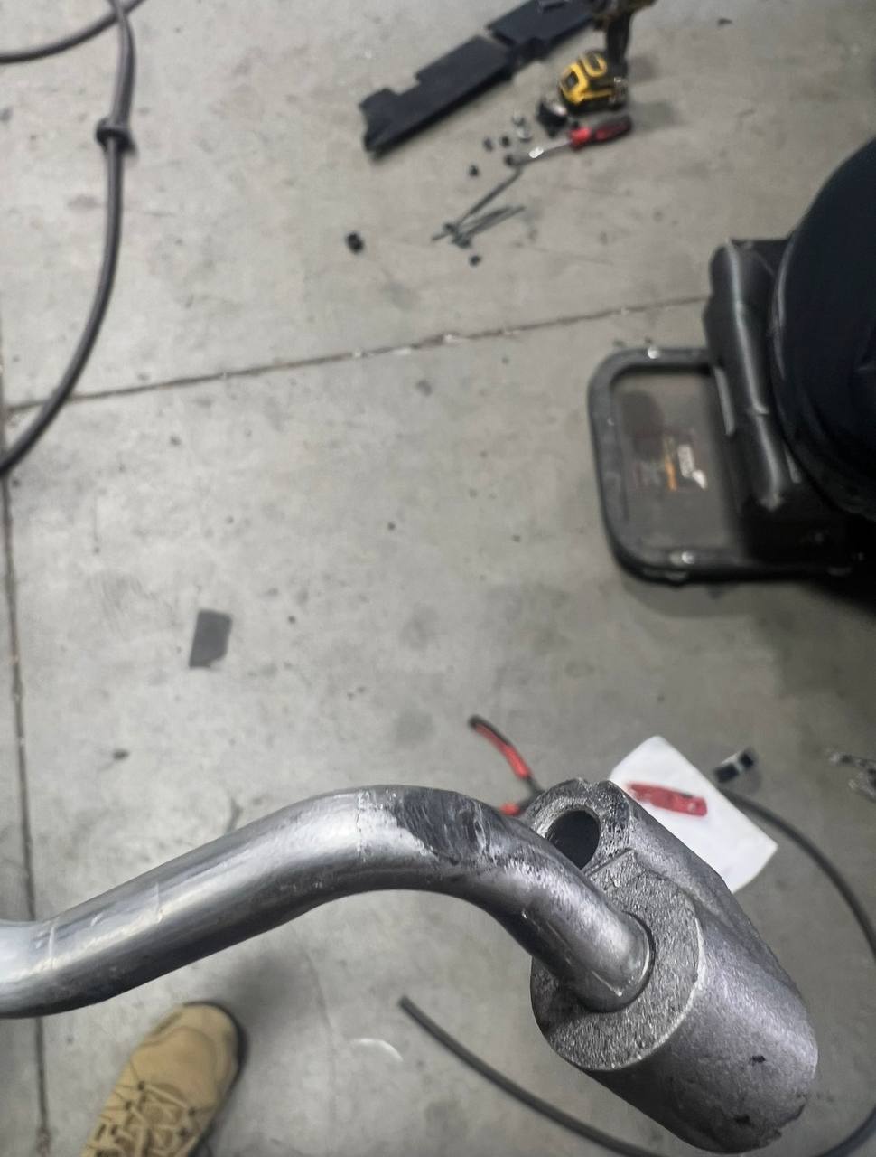 Close-up of the damaged AC line area after the winch body wore through it