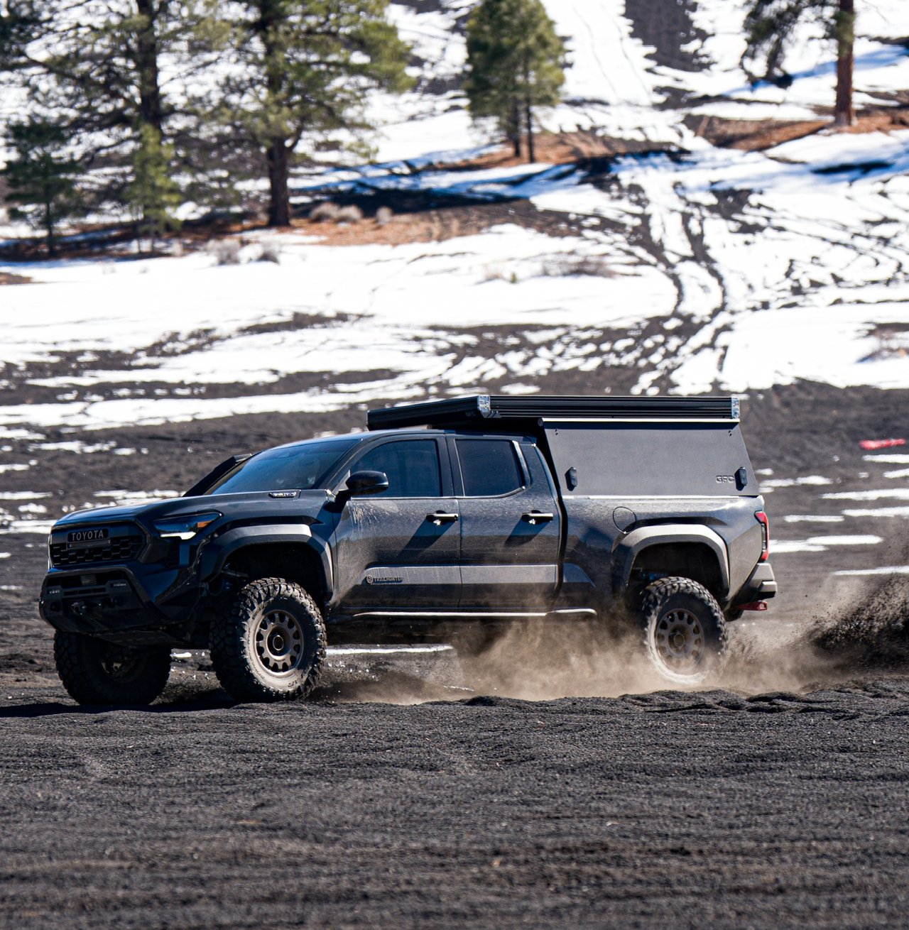 Trailhunter kicking up dirt with CBI Covert bumper and GFC camper