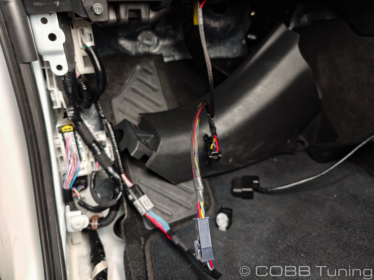 Full view — bypass harness connected, OBD cable ready for Accessport