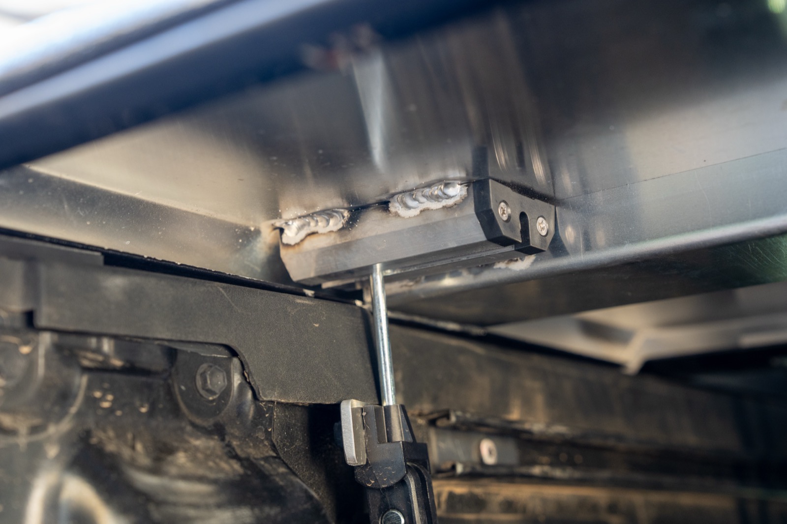 TIG welds and the toolless clamp jaw where the Switchback 2.0 meets the Tacoma bed rail