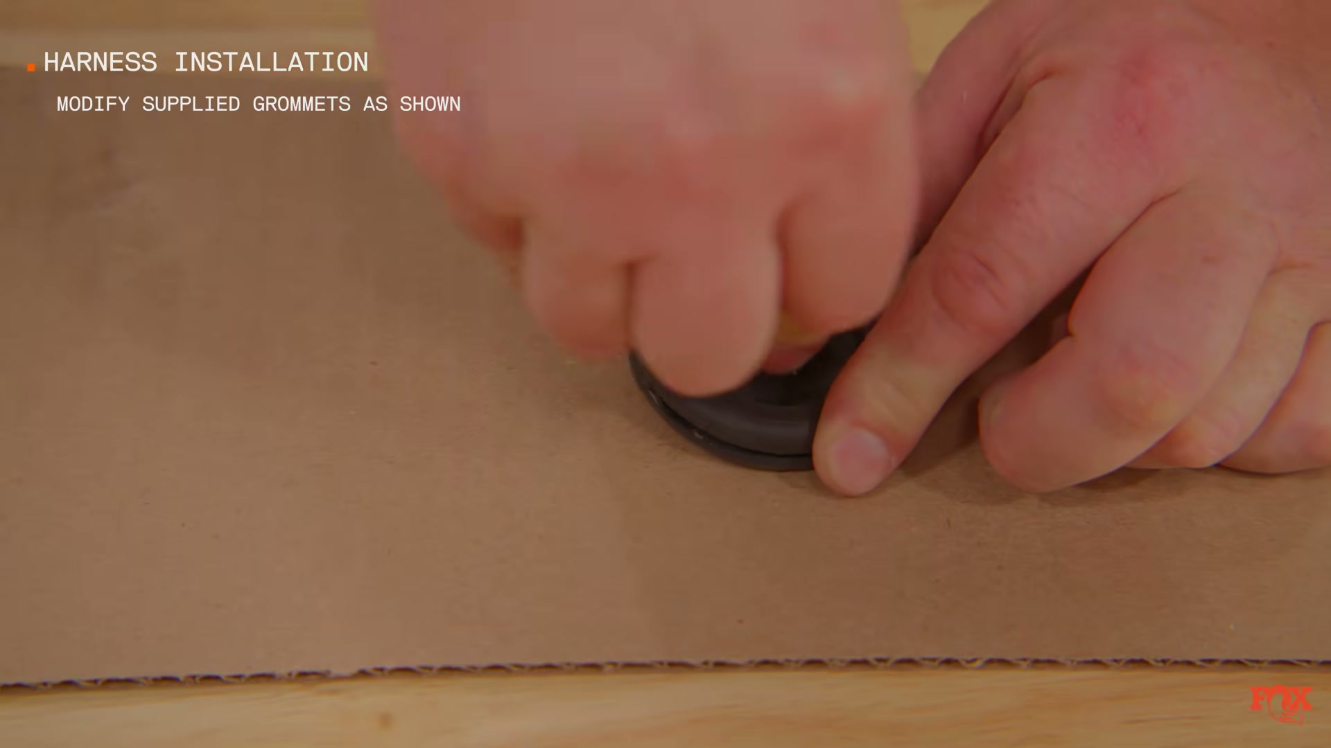 Fox Live Valve grommet modification — cutting and combining grommets for weathersealed floor penetration — source: Fox Racing