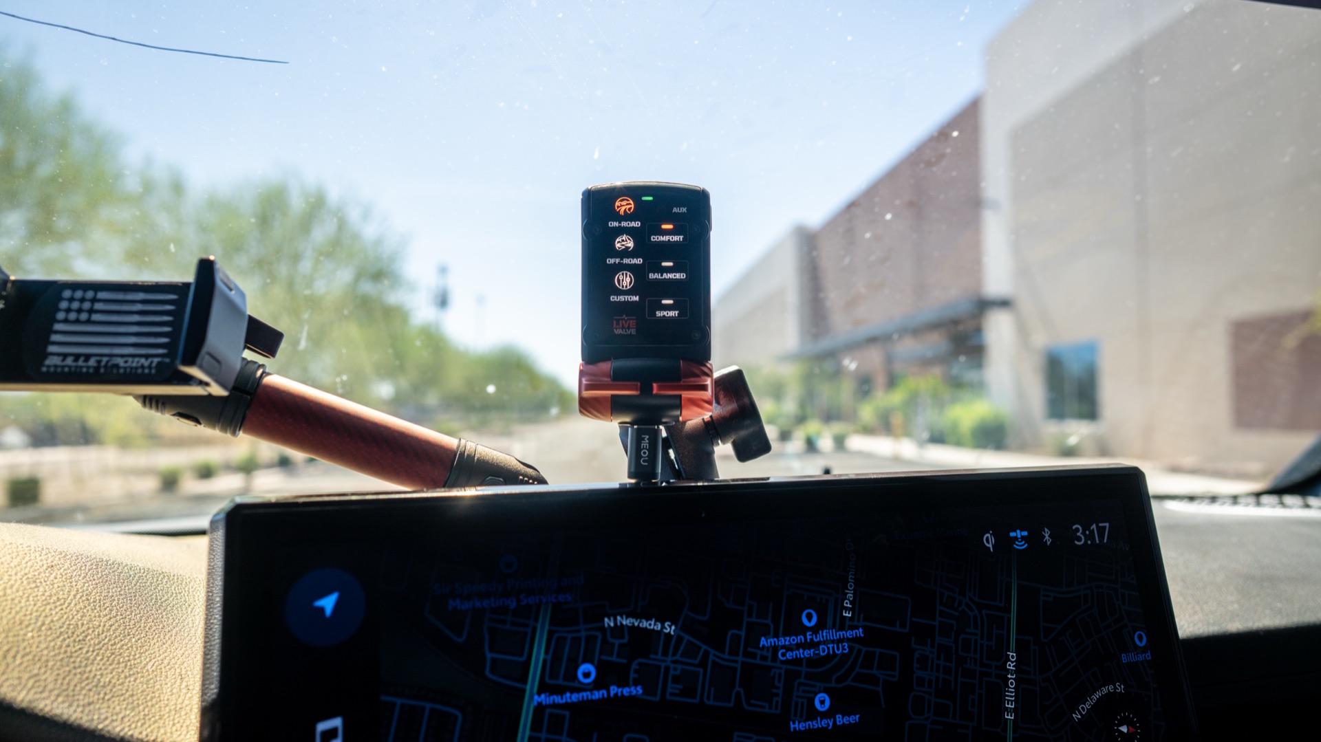Fox Live Valve mode selector paired and running on a ball mount above the dash of my Tacoma, mode LEDs lit — photo: SDHQ Off Road