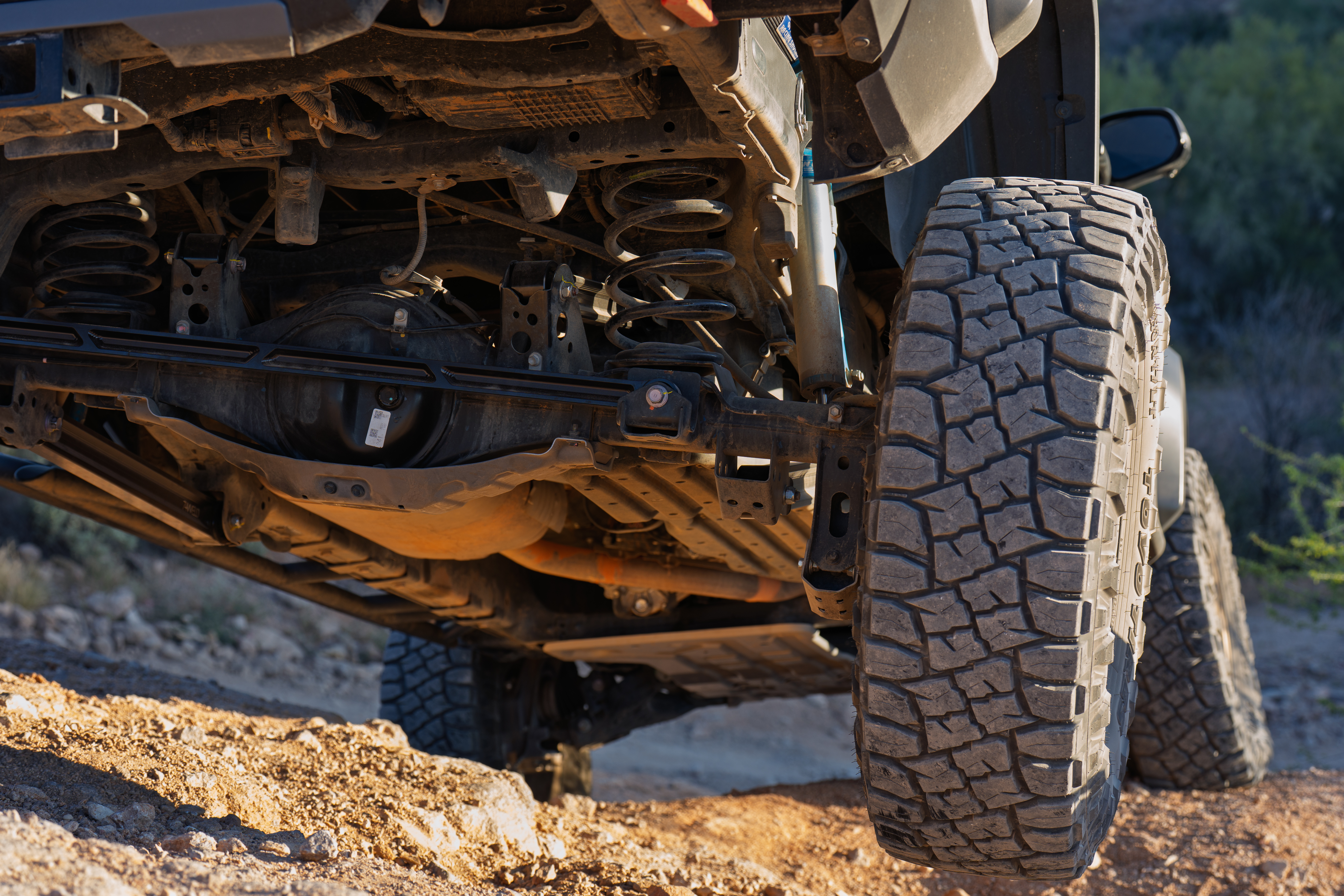 74Weld billet link visible through the rear wheel assembly after install