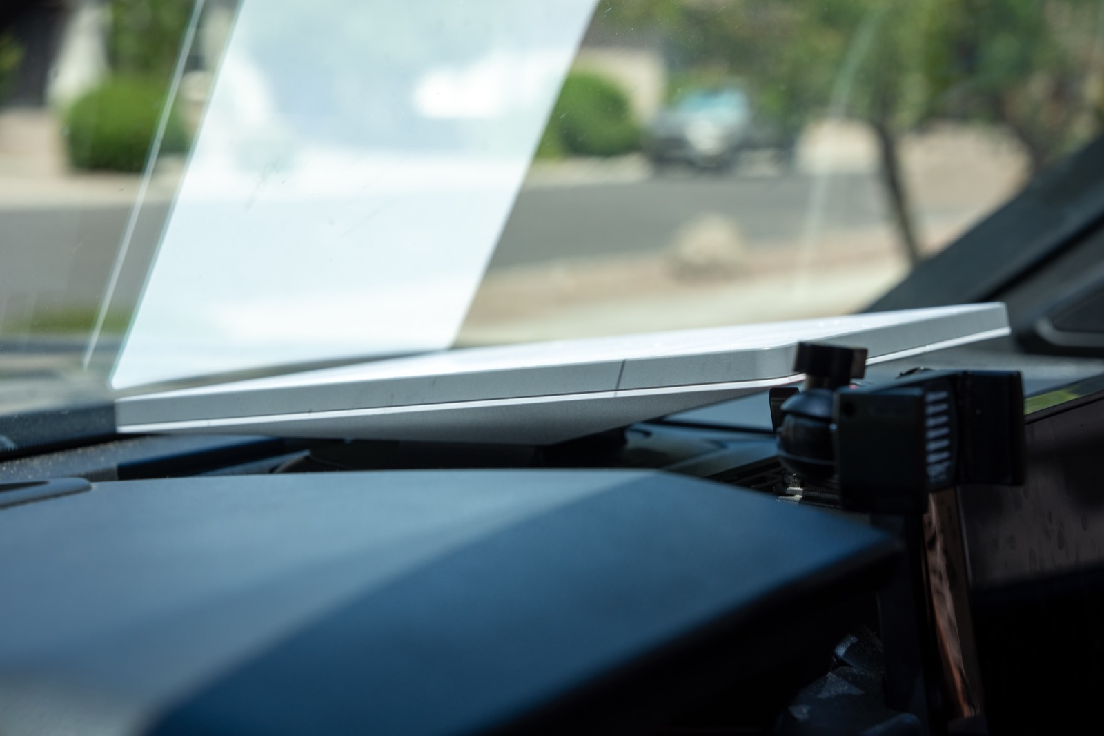 Starlink Mini mounted on the dashboard of a 2024 Tacoma Trailhunter using the Broken Rover JBL receptacle mount