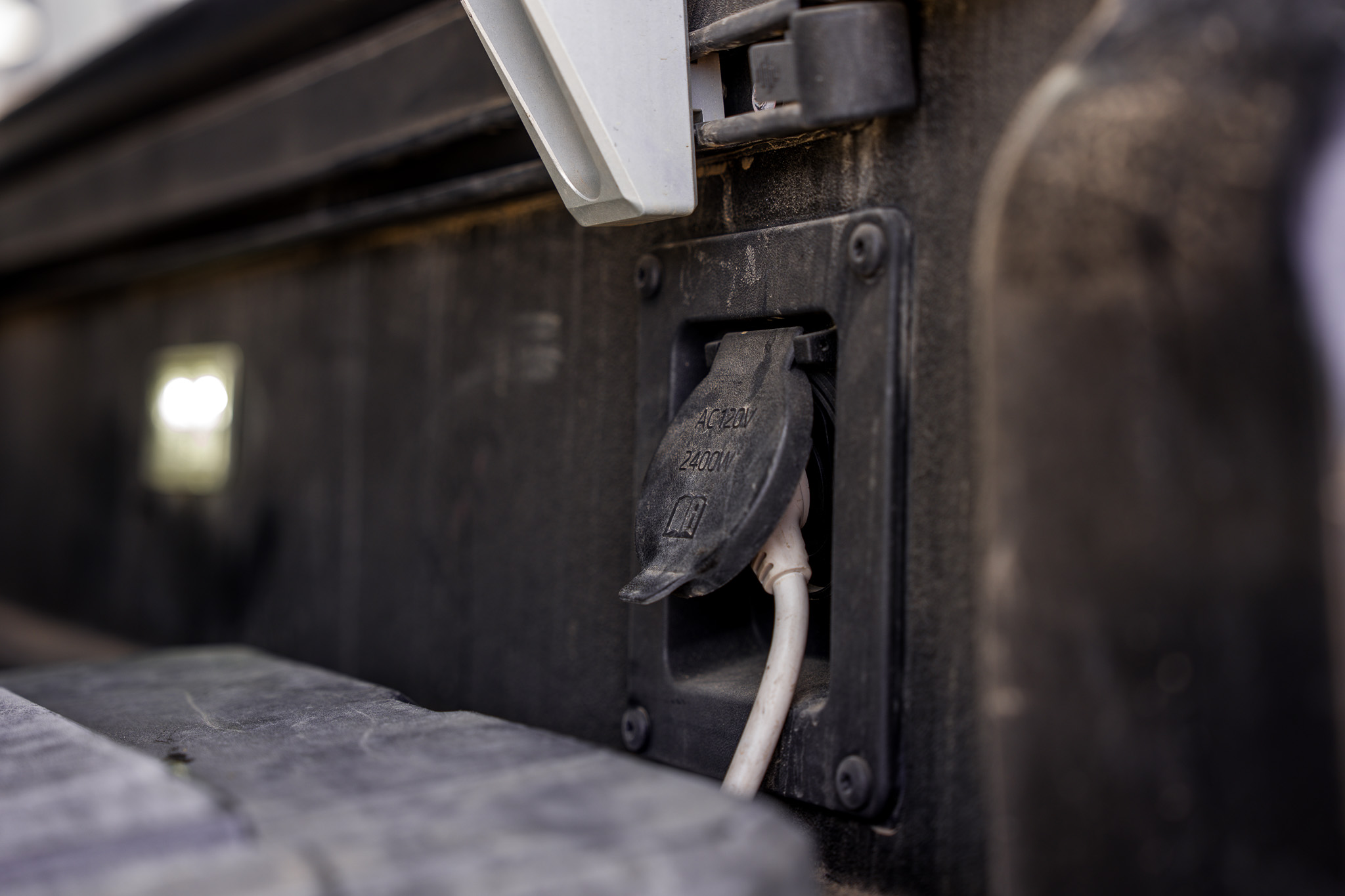 120V AC 2400W bed outlet on the Tacoma Trailhunter with Starlink cord plugged in