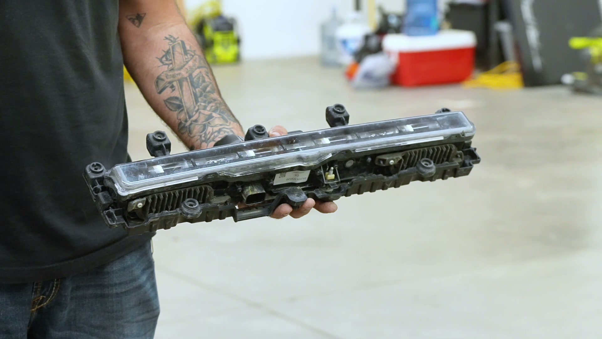 Factory OEM TRD Pro grille light bar removed showing CAN bus module