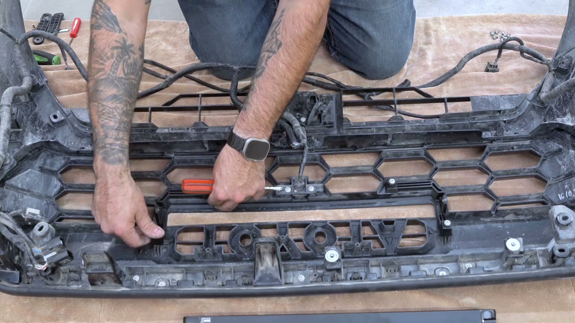 Installing Triple-R mounting brackets on the TRD Pro grille frame